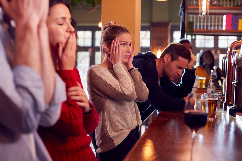 Group of disappointed customers in sports Bar